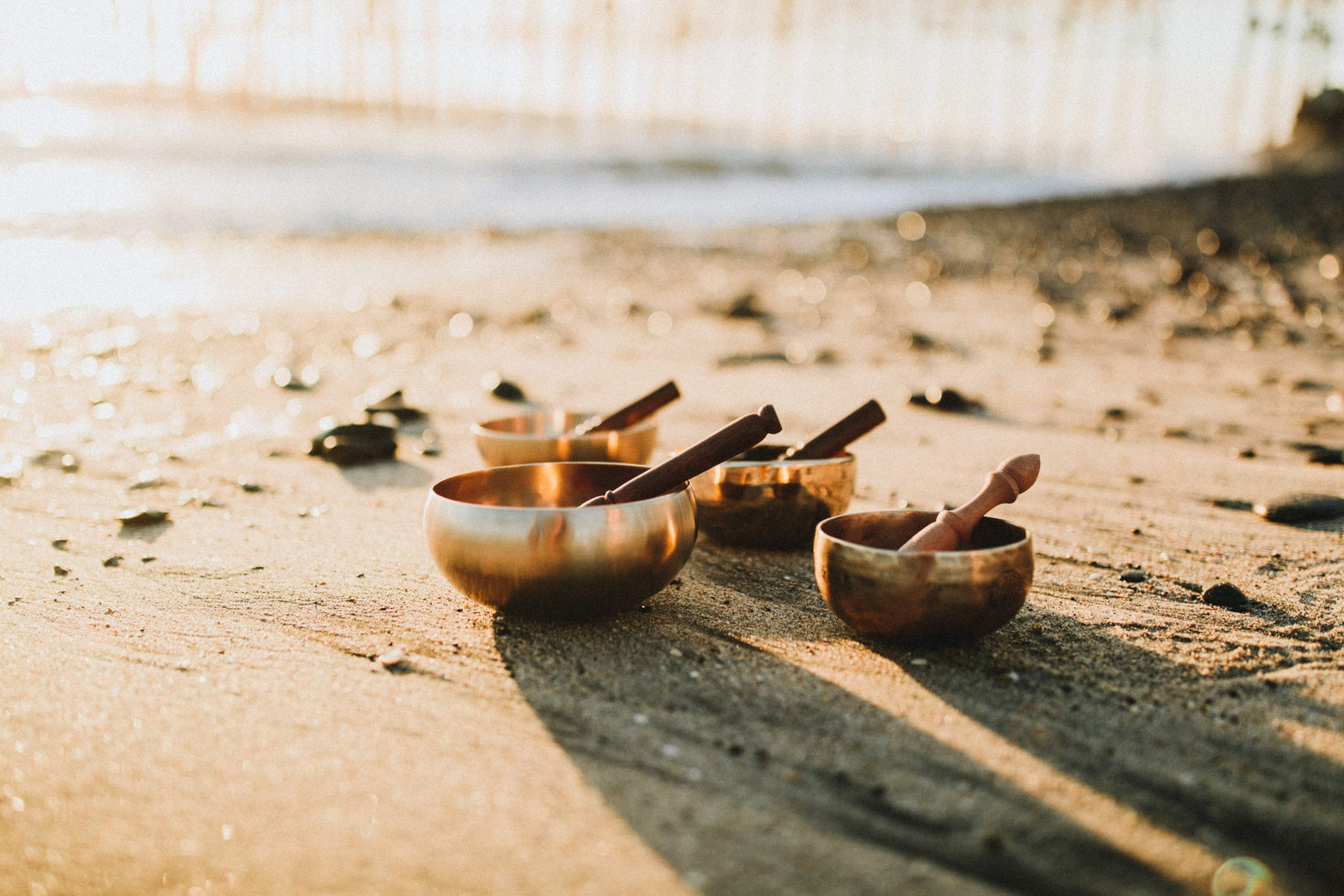 How do you play a singing bowl?