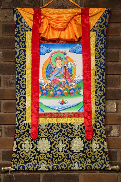 Thangka enmarcado por Guru Rinpoche